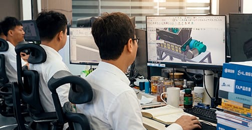 RICHI engineers performing technical data analysis and system integration for feed plants